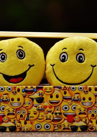 a box printed with happy emoticons
