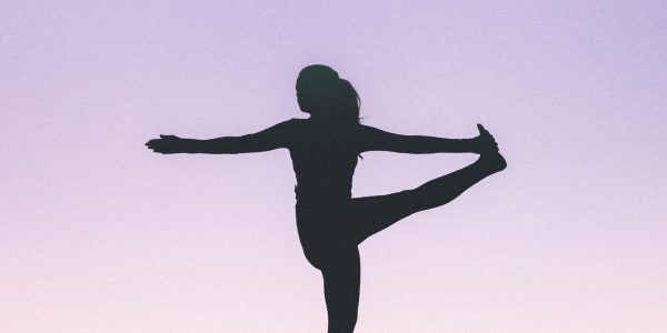 silhouette of a woman working out