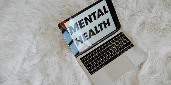 Mental health written on a laptop