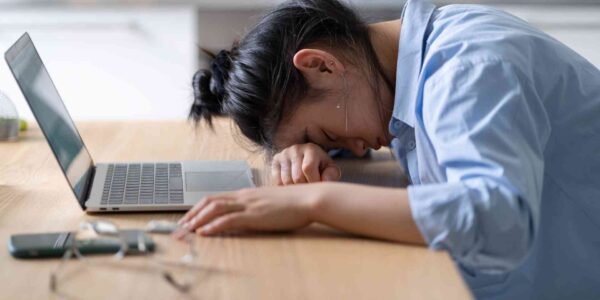 A women exhausted due to workplace burnout